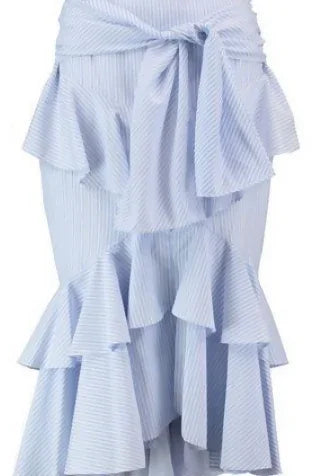 Woman wearing white tied crop top and light blue tiered poplin skirt with platform sandals — Rebecca Vallance | Endless UAE