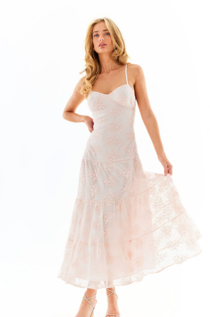 Elegant blush pink lace maxi dress with thin straps and tiered skirt, worn with strappy heels — Amy Jane London | Endless UAE