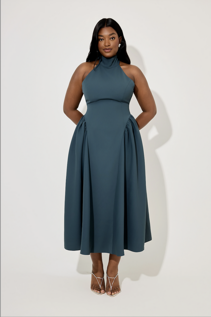 Teal halter neck midi dress with gathered skirt detail and tie neck, modeled by woman in strappy heels — Oddmuse | Endless UAE