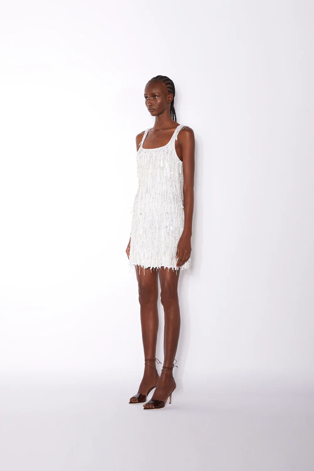 White fringed mini dress with square neckline and sleeveless design — ILTA | Endless UAE