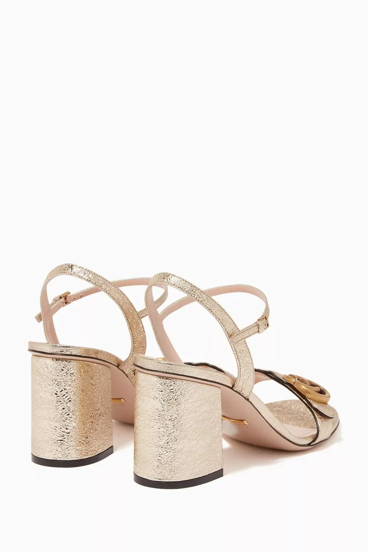 Metallic gold Marmont laminate leather sandals with block heel and GG buckle — Gucci | Endless UAE
