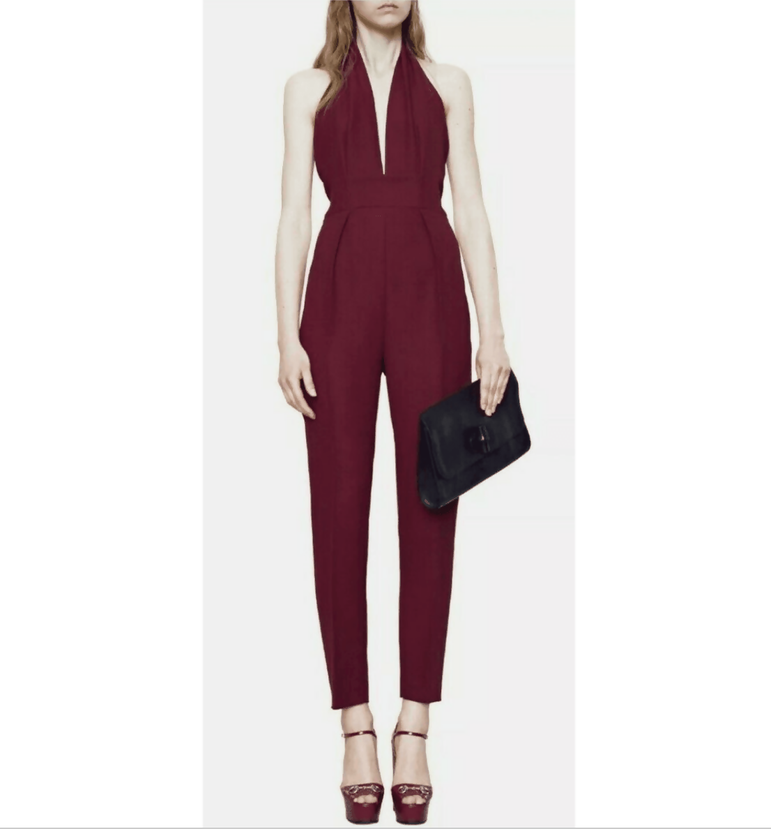 Elegant plum halter neck jumpsuit with deep V-neckline, tailored fit, and tapered legs, styled with platform heels — Gucci | Endless UAE