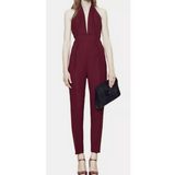Elegant plum halter neck jumpsuit with deep V-neckline, tailored fit, and tapered legs, styled with platform heels — Gucci | Endless UAE