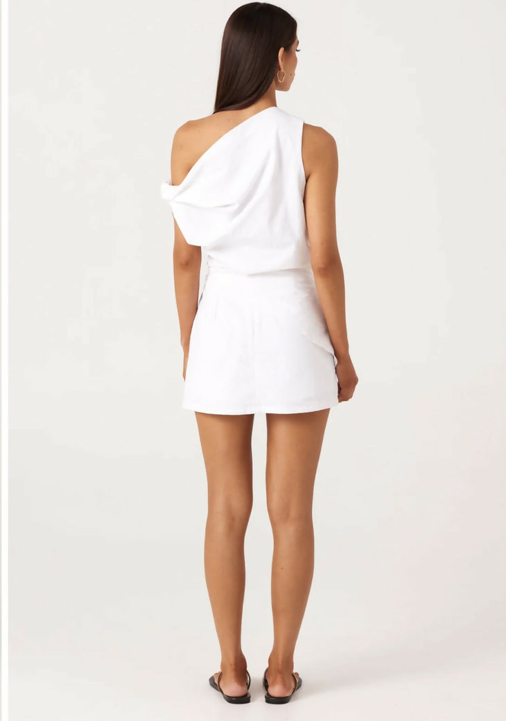 Woman wearing white asymmetrical co-ord set with one-shoulder top and mini skirt, back view — SNDYS | Endless UAE