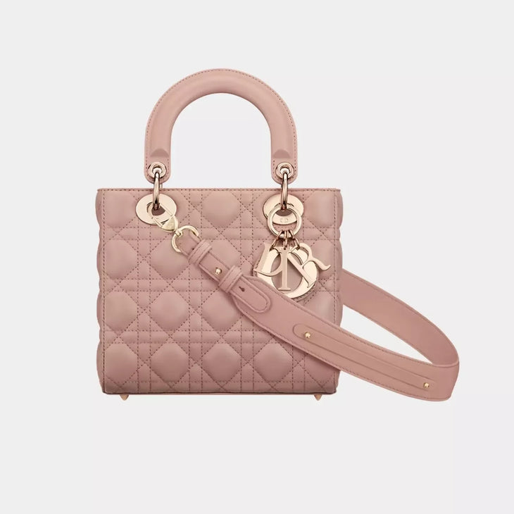 Small quilted pink leather Lady Dior bag with top handles, detachable shoulder strap, and gold-tone charms — Christian Dior | Endless UAE