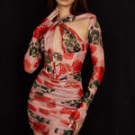 Sheer rose print long sleeve mini dress with corset bodice and ruched skirt on model against black background — House of CB | Endless UAE
