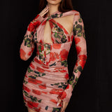 Sheer rose print long sleeve mini dress with corset bodice and ruched skirt on model against black background — House of CB | Endless UAE