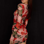 Woman wearing rose print corset mini dress with long sleeves and ruched detailing on black background — House of CB | Endless UAE