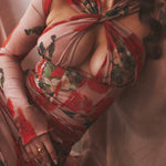 Romantic floral print mesh corset mini dress with long sleeves and draped detailing in red and pink tones — House of CB | Endless UAE