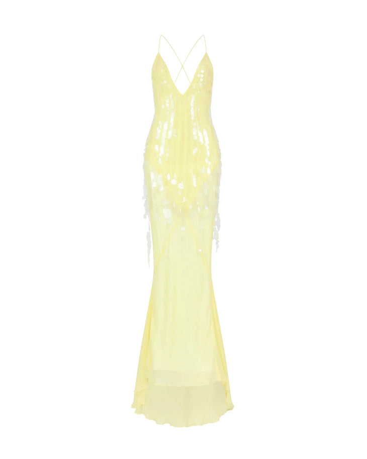 Woman wearing yellow sequined halter gown with flowing train and flower hair accessory — Rat & Boa | Endless UAE