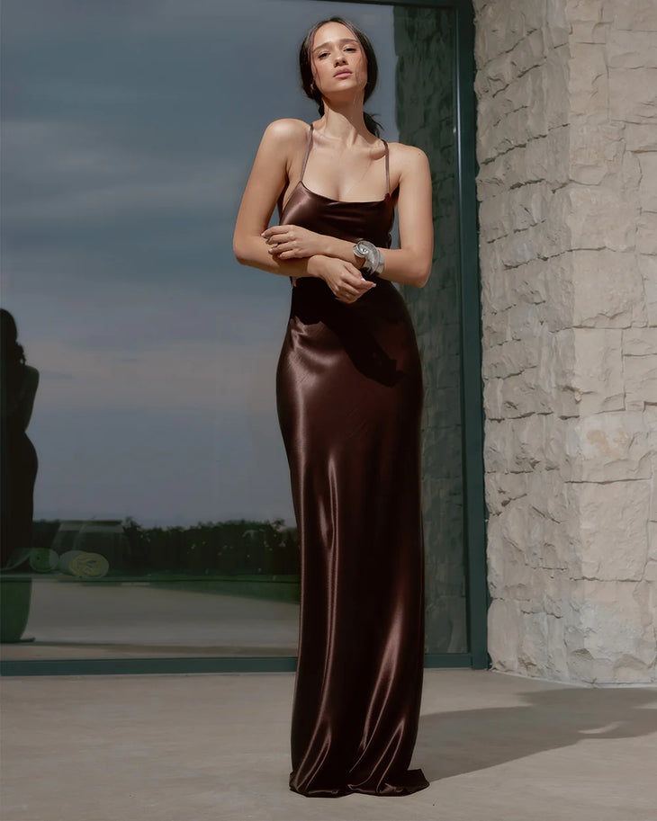 Brown satin slip dress with thin straps and flowing maxi silhouette — Dvete | Endless UAE