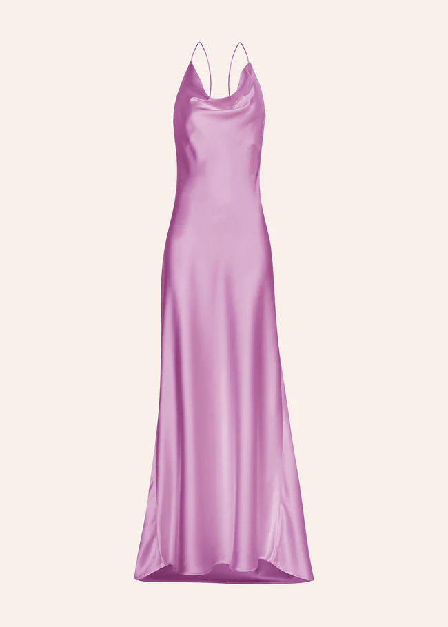 Woman wearing a pink satin slip dress with thin straps and flowing maxi length — Dvete | Endless UAE