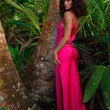 Woman wearing hot pink satin slip dress in tropical setting — Rat & Boa | Endless UAE