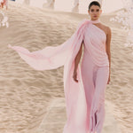 Woman wearing pink textured maxi dress in desert setting — Lichi | Endless UAE