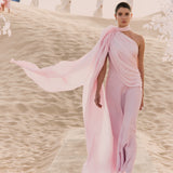 Woman wearing pink textured maxi dress in desert setting — Lichi | Endless UAE