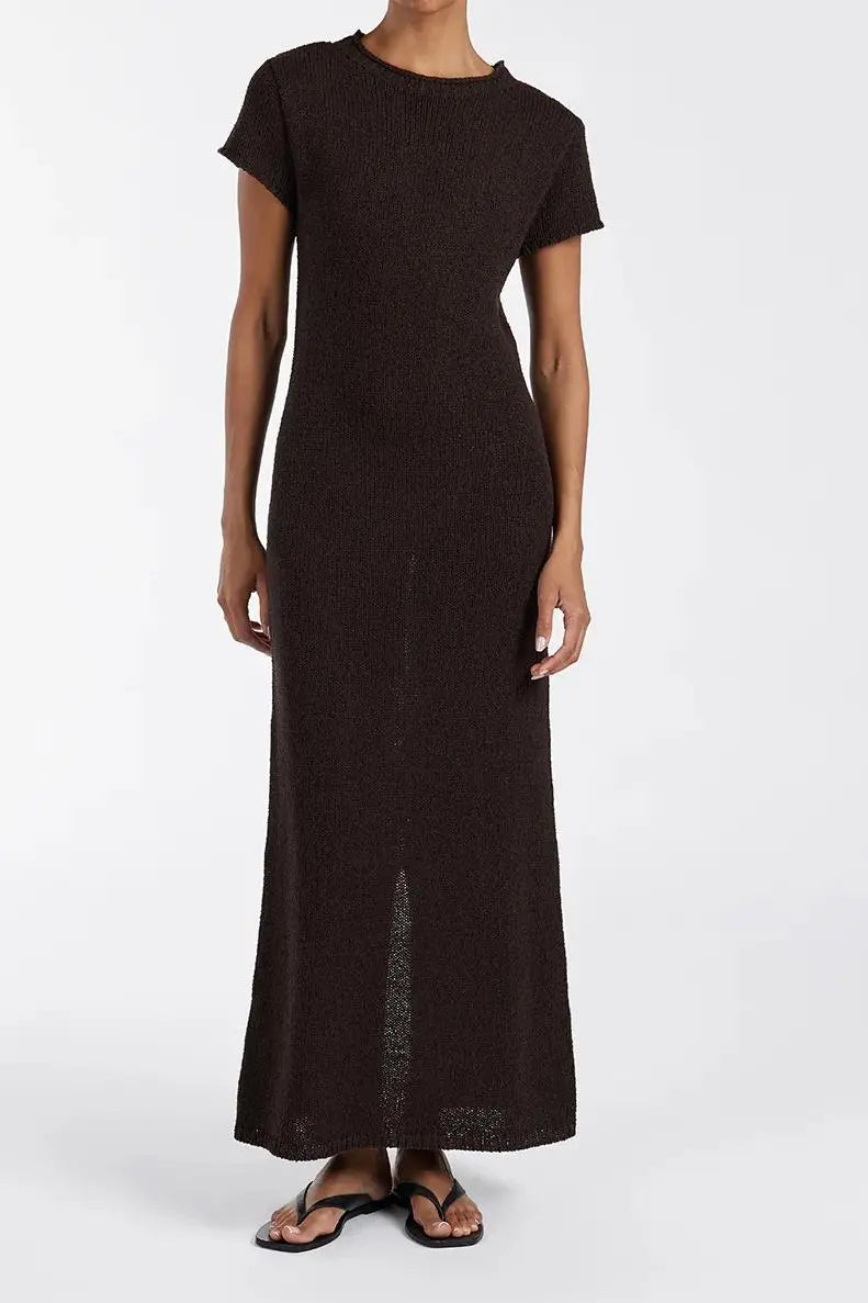Woman wearing dark brown ribbed knit midi dress with short sleeves and front slit — DISSH | Endless UAE