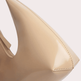 Baby Amber semi patent mini leather handbag in beige with pointed toe detail and top handle — By Far | Endless UAE
