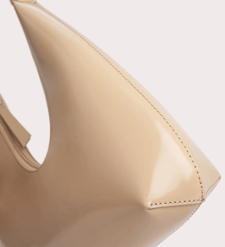 Baby Amber semi patent mini leather handbag in beige with pointed toe detail and top handle — By Far | Endless UAE