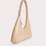 Baby Amber semi-patent mini leather hobo bag in beige with adjustable shoulder strap and buckle detail — By Far | Endless UAE