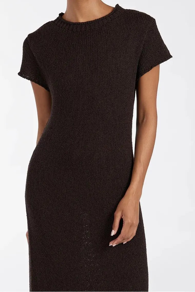 Woman wearing dark brown ribbed knit midi dress with short sleeves and front slit — DISSH | Endless UAE