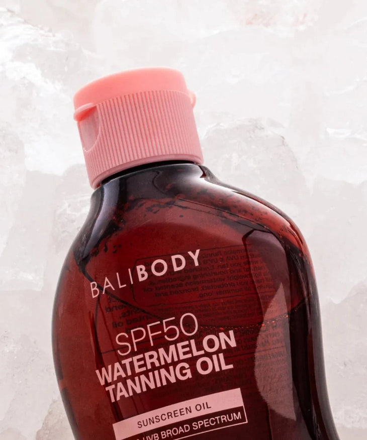 Bali Body SPF50 Watermelon Tanning Oil in amber bottle with pink cap — Powder Beauty | Endless UAE