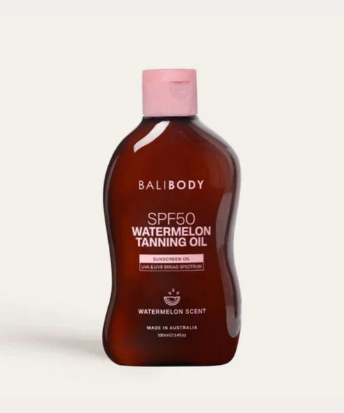 Bali Body SPF50 Watermelon Tanning Oil in amber bottle with pink cap — Powder Beauty | Endless UAE