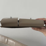 Beige patent leather shoulder bag with dual compartments and silver turnlock closures — Endless | Endless UAE