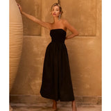 Black strapless midi dress with fitted bodice and flowing skirt, styled with nude heels — Anne Louise Boutique | Endless UAE