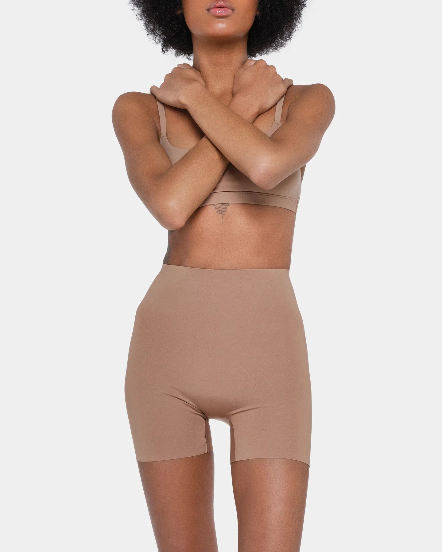 Beige booty boosting shorts with enhanced contouring design — Underhance | Endless UAE