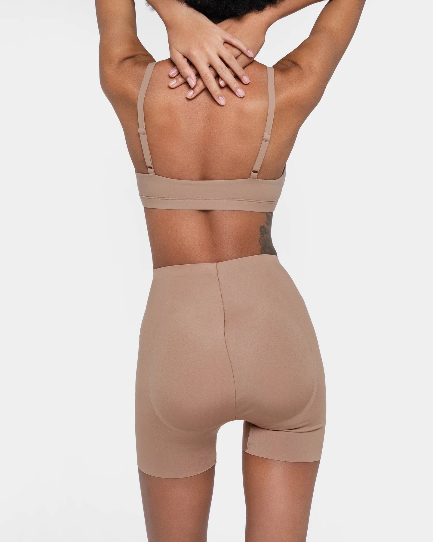 Beige booty boosting shorts with enhanced contouring design — Underhance | Endless UAE