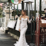 Fitted lace mermaid wedding dress with off-shoulder sleeves and floral appliqués — You&I Bridal | Endless UAE