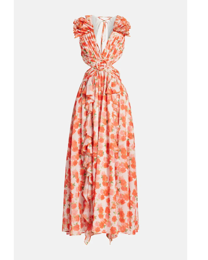 Woman wearing a coral floral maxi dress with flutter sleeves and cutout waist detail — Anne Louise Boutique | Endless UAE