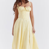 Pale yellow bustier sundress with corset bodice and flowing midi skirt — House of CB | Endless UAE