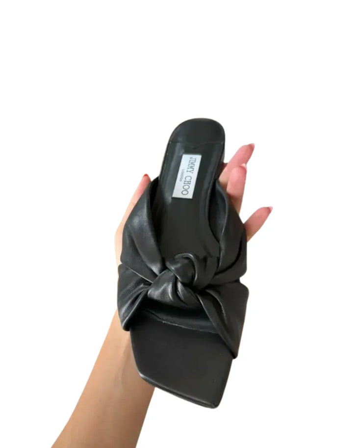 Black leather flat sandals with bow detail — Jimmy Choo | Endless UAE