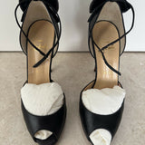 Black leather peep-toe platform pumps with bow detail and lace-up ankle straps — Christian Louboutin | Endless UAE