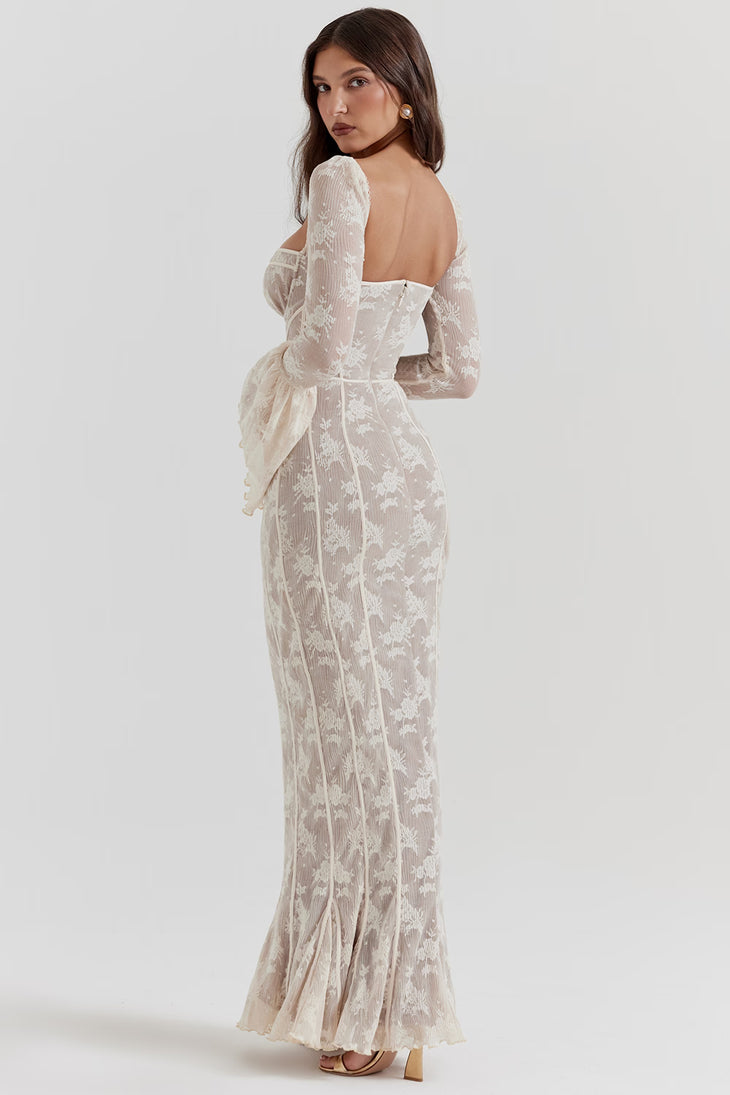 Elegant champagne lace maxi dress with long sleeves, open back, and peplum waist detail on model — House of CB | Endless UAE