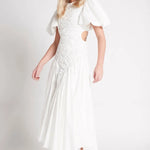 Woman wearing white Siren Drawstring Midi Dress with puffed sleeves and green strappy heels — Aje | Endless UAE