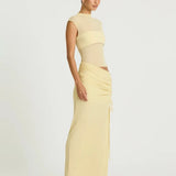 Pale yellow sleeveless maxi dress with cutout waist detail and ruched skirt — BENNI. | Endless UAE.