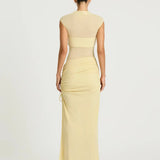 Pale yellow sleeveless maxi dress with cutout waist detail and ruched skirt — BENNI. | Endless UAE.