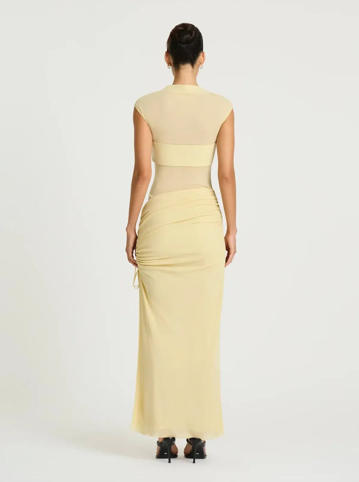 Pale yellow sleeveless maxi dress with cutout waist detail and ruched skirt — BENNI. | Endless UAE.
