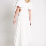 Woman wearing white Siren Drawstring Midi Dress with puffed sleeves and green strappy heels — Aje | Endless UAE