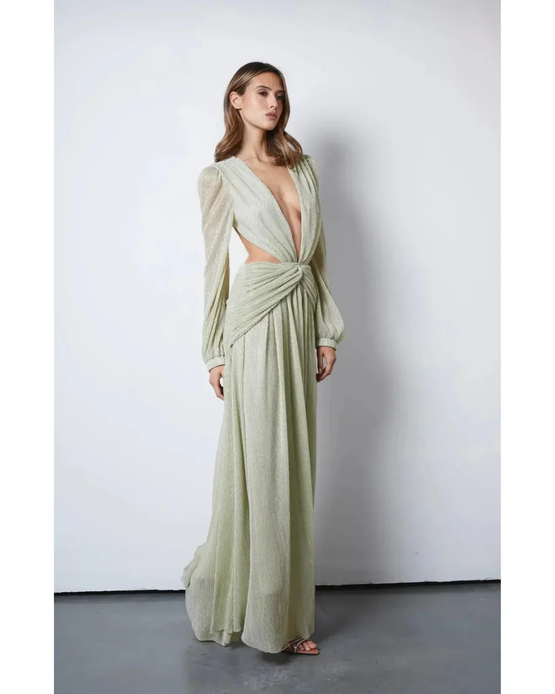 Woman wearing The Goddess Green Dress by Anne Louise Boutique — Endless UAE