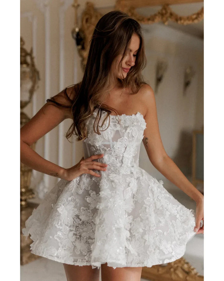 White strapless lace dress with textured floral details and fitted bodice — Rosie Etienne | Endless UAE