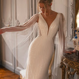 Embellished mermaid wedding dress with flowing cape and plunging neckline — Katy Corso Glen | Endless UAE