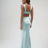 Light blue satin maxi skirt with high waist and floor-length silhouette, shown from back — By Keara | Endless UAE