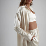 Ivory satin sculpted bralette styled with matching oversized shirt and shorts in luxe coordinated set — By Keara | Endless UAE