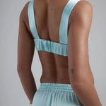 Light blue satin sculpted bralette with wide straps and open back design — By Keara | Endless UAE