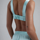 Light blue satin sculpted bralette with wide straps and open back design — By Keara | Endless UAE