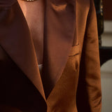 Elegant brown blazer with peak lapels and button closure worn over pearl necklace — By Keara | Endless UAE