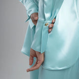 Light blue oversized shirt worn open over white crop top with matching pants — By Keara | Endless UAE